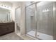 Modern bathroom with walk-in shower, tile walls, and vanity at 4148 Lavender Ct, Lake Hamilton, FL 33851