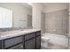 Well-appointed bathroom with a granite countertop vanity, tiled tub/shower combo, and modern fixtures at 4148 Lavender Ct, Lake Hamilton, FL 33851