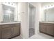 Spacious bathroom featuring dual vanities, granite countertops, and a walk-in closet at 4148 Lavender Ct, Lake Hamilton, FL 33851