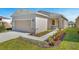 Attractive curb appeal with a well-maintained lawn, stone accents, and a two-car garage at 4148 Lavender Ct, Lake Hamilton, FL 33851