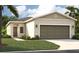 Charming single-story home with a two-car garage and landscaped front yard at 4148 Lavender Ct, Lake Hamilton, FL 33851