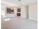 Open concept kitchen and living area with tile flooring and dark wood cabinets at 4148 Lavender Ct, Lake Hamilton, FL 33851