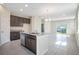 Kitchen island with granite countertop, stainless steel appliances, and sliding glass doors at 4148 Lavender Ct, Lake Hamilton, FL 33851