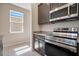 Kitchen with stainless steel appliances, granite countertops, and ample cabinet space at 4148 Lavender Ct, Lake Hamilton, FL 33851