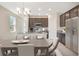 Kitchen with dark wood cabinets, stainless steel appliances, and island with seating at 4148 Lavender Ct, Lake Hamilton, FL 33851