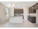 Kitchen with island, dark wood cabinets, and stainless steel appliances at 4148 Lavender Ct, Lake Hamilton, FL 33851