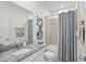 Guest bathroom with granite countertops, a bathtub, and a striped shower curtain at 4164 Lavender Ct, Lake Hamilton, FL 33851