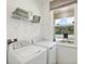 Laundry room with a washer, dryer, and ample storage space at 4164 Lavender Ct, Lake Hamilton, FL 33851