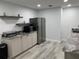 Modern kitchen featuring stainless steel appliances, granite countertops, and ample cabinet space at 443 Hamptoncrest Cir # 103, Lake Mary, FL 32746