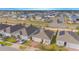 An aerial view of the neighborhood, with several homes and solar panels on the roofs at 473 Disa Dr, Davenport, FL 33837