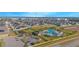 An aerial view of the community, showcasing the pool, playground, and many homes at 473 Disa Dr, Davenport, FL 33837