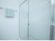 Bright, clean bathroom with a glass shower and tiled walls at 473 Disa Dr, Davenport, FL 33837