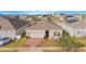 A view of the home, neighboring properties, and community streets at 473 Disa Dr, Davenport, FL 33837