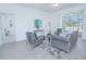 Inviting living room with contemporary furniture, a plush rug, and sliding glass doors at 473 Disa Dr, Davenport, FL 33837