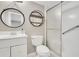 Bathroom featuring a standing shower, white vanity, and modern fixtures at 6030 Village Cir, Orlando, FL 32822