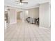 Dining area adjacent to the kitchen, featuring tile flooring and a ceiling fan at 6030 Village Cir, Orlando, FL 32822