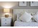 Cozy bedroom with a neutral color scheme and white bedding at 781 Ocean Course Ave # 601, Davenport, FL 33896
