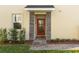 Inviting house exterior featuring a red door and stone accents at 781 Ocean Course Ave # 601, Davenport, FL 33896