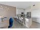 Modern kitchen with island, white cabinets, and stainless steel appliances at 781 Ocean Course Ave # 601, Davenport, FL 33896