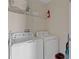 Bright laundry room with washer, dryer, and storage at 781 Ocean Course Ave # 601, Davenport, FL 33896