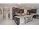 Spacious kitchen with large island, stainless steel appliances, and ample counter space at 1660 Andover Ridge Dr, Deland, FL 32720