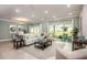 Living room with comfortable seating, sliding glass doors, and neutral decor at 1660 Andover Ridge Dr, Deland, FL 32720