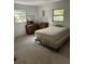 Bedroom with queen bed and dresser at 1918 Mountain Lake Cutoff Rd, Lake Wales, FL 33859