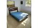 Bedroom with double bed and dresser at 1918 Mountain Lake Cutoff Rd, Lake Wales, FL 33859