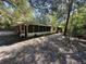 View of home's side, screened porch at 1918 Mountain Lake Cutoff Rd, Lake Wales, FL 33859