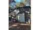 Large metal garage with roll-up door at 1918 Mountain Lake Cutoff Rd, Lake Wales, FL 33859