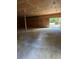Unfinished garage interior with concrete floor at 1918 Mountain Lake Cutoff Rd, Lake Wales, FL 33859