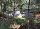 Exterior view of metal garage building in wooded area at 1918 Mountain Lake Cutoff Rd, Lake Wales, FL 33859