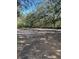 Open, mostly clear land with dirt and sparse vegetation at 1918 Mountain Lake Cutoff Rd, Lake Wales, FL 33859