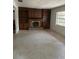 Living room with fireplace and built-in shelving at 1918 Mountain Lake Cutoff Rd, Lake Wales, FL 33859