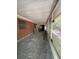 Screened porch with brick wall and storage at 1918 Mountain Lake Cutoff Rd, Lake Wales, FL 33859