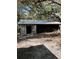 Small storage shed with metal roof and open door at 1918 Mountain Lake Cutoff Rd, Lake Wales, FL 33859