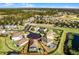 Birds-eye view of a home with covered patio and fenced backyard at 2213 Grantham Ave, Davenport, FL 33837