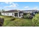 Large backyard with a pool, lush lawn, and plenty of space for activities at 2213 Grantham Ave, Davenport, FL 33837
