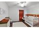 Charming Bedroom with crib, changing table, rocking chair, and decorative accent wall at 2213 Grantham Ave, Davenport, FL 33837