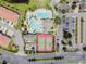 Aerial view of community amenities, including tennis courts, playground, pool, and parking at 2213 Grantham Ave, Davenport, FL 33837