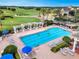 Community pool with lap lanes and lounge area overlooking a golf course at 2213 Grantham Ave, Davenport, FL 33837