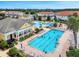 Aerial view of community pool with lap lanes and a separate pool with waterslide at 2213 Grantham Ave, Davenport, FL 33837