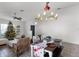 Dining table set for a holiday meal with the living room and Christmas tree visible at 2213 Grantham Ave, Davenport, FL 33837