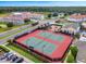 Two tennis courts next to a playground in a residential community at 2213 Grantham Ave, Davenport, FL 33837