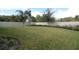 Large fenced backyard with grassy area and mature trees at 2393 Jernigan Loop, Kissimmee, FL 34746