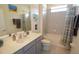 Bathroom with tub shower combo and updated vanity at 2393 Jernigan Loop, Kissimmee, FL 34746