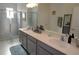 Double vanity bathroom with walk-in shower and modern fixtures at 2393 Jernigan Loop, Kissimmee, FL 34746