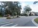 Gated community entrance with signage and landscaping at 2393 Jernigan Loop, Kissimmee, FL 34746