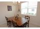 Bright dining room with wooden table and four chairs at 2393 Jernigan Loop, Kissimmee, FL 34746