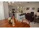 Dining area with wooden table and chairs, adjacent to the kitchen at 2393 Jernigan Loop, Kissimmee, FL 34746
